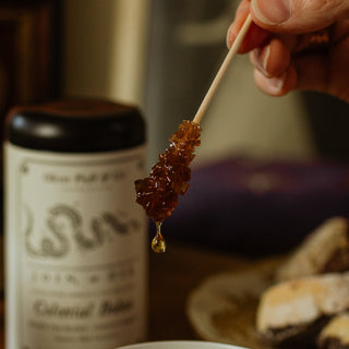 a close up view of a hard sugar swizzle stick melting