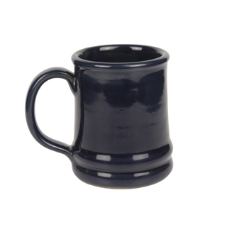 the backside of a glazed ceramic dark blue mug