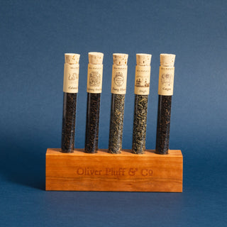 5 glass tubes filled with approx. 9-15g of loose tea each on wooden holder