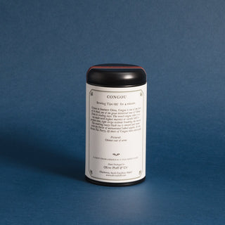 brewing instructions on backside of black tea tin with blue backdrop
