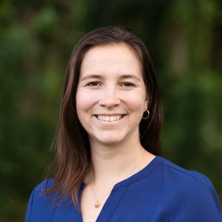 headshot of woman with short brown hair and brown eyes