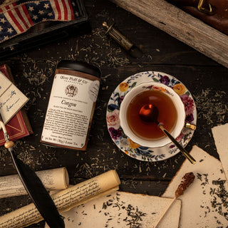 congou loose tea tin with cup of brewed tea
