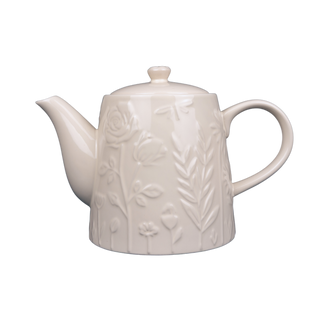 white teapot with raised floral design on white background