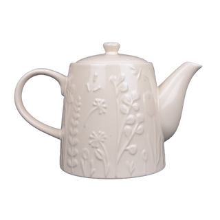 white teapot with raised floral design on white background