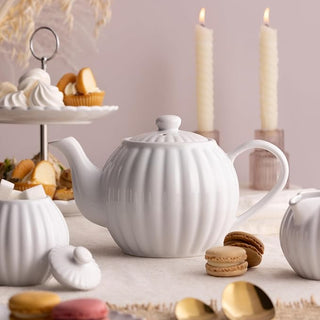 white teapot on table setting