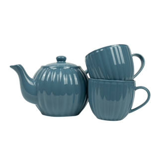 Ribbed blue teapot and tea cups on white background
