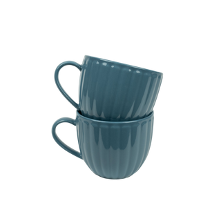 Ribbed blue tea cups on white background
