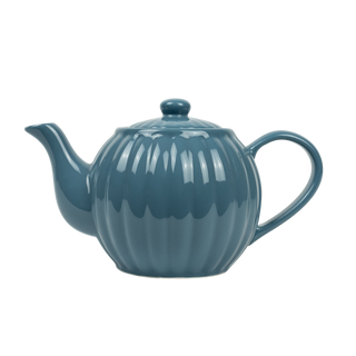 Ribbed blue teapot on white background