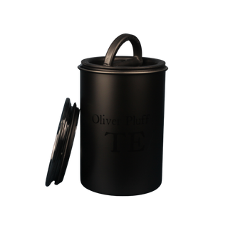 Black cylindrical container with lid on a white background