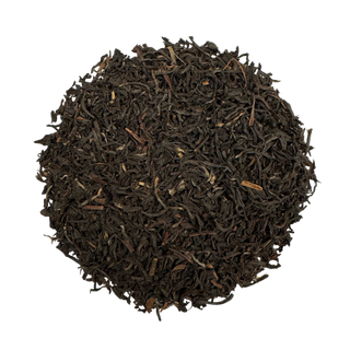Dry black tea leaves on a white background