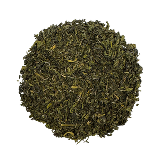 Pile of green tea leaves on a white background
