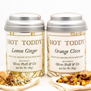 two small silver tea tins with yellow flowery graphic