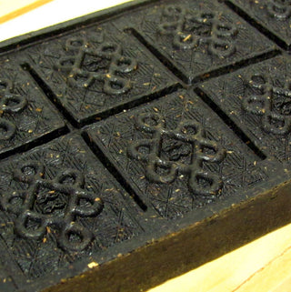 close up view of black tea brick design