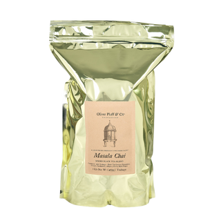 gold shiny bag with loose leaf tea and a brown label