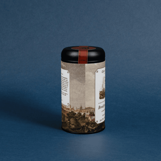  cylindrical product with vintage-style label on a blue background