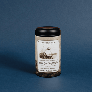 Tea canister with label on a blue background