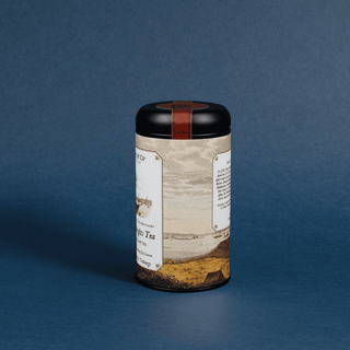 Tea canister with label on a blue background