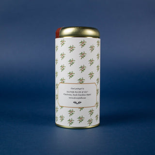 the back of gold coffee tin with seasonal greenery label