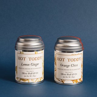 two small silver tea tins with yellow flowery graphic