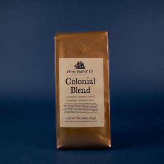 one orange-golden coffee bag with black and white sailboat on label sitting on kitchen counter