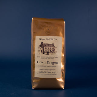 shiny gold coffee bag with old timey house graphic on label