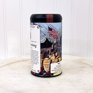 Side view of boston tea party graphic on black tea tin