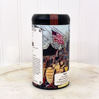 side view of boston tea party graphic on decorative tea tin