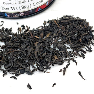 close up view of black loose leaf tea on white counter