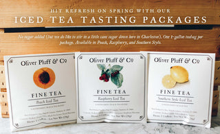 three different 1-gallon teabag sealed in 5.25"x5.25" white envelope with decorative labels against wooden box