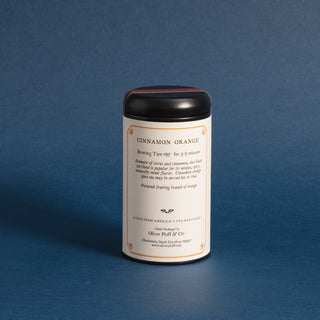 black tea tin with brewing instructions on label. Blue background