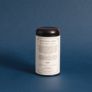 brewing instructions on backside of black tea tin with blue backdrop 