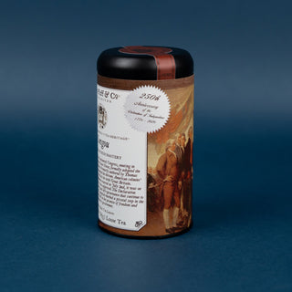 Tea canister with label on a blue background