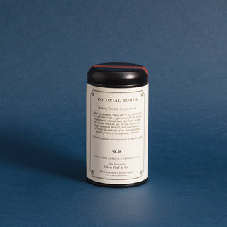 black tea tin with brewing instructions on label, blue background