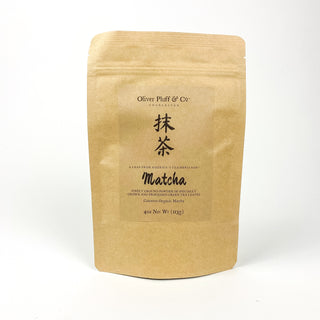 golden yellow tea pouch bag with loose leaf matcha inside