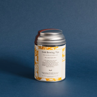 brewing instructions on small silver tea tin with yellow design on label