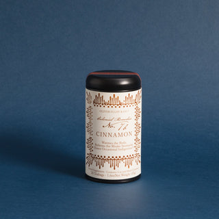 black tea tin with orange pattern on label