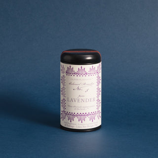 black tea tin with purple pattern on label