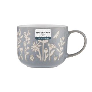 blue mug with floral patterns and a visible 'Mason Cash' label on a white background