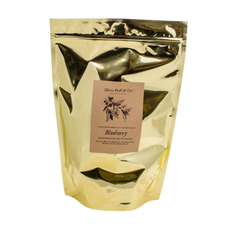 Gold foil tea bag with a label on a white background