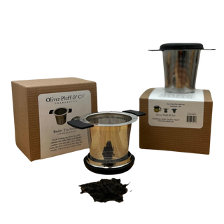 stainless steel brewing basket sitting on top of its box 