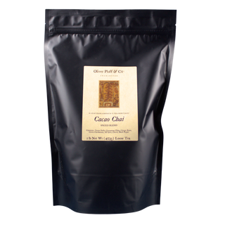 Black tea bag with a label on a white background