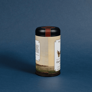 Tea canister with label on a blue background