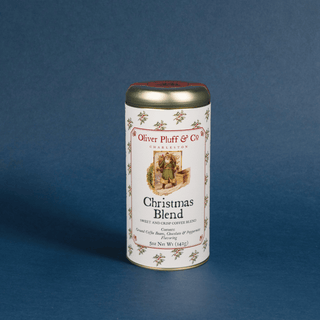 Coffee canister labeled 'Christmas Blend' by Oliver Pluff & Co on a blue background