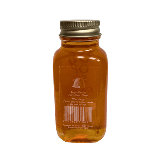Bottle of honey with a gold cap on a transparent background