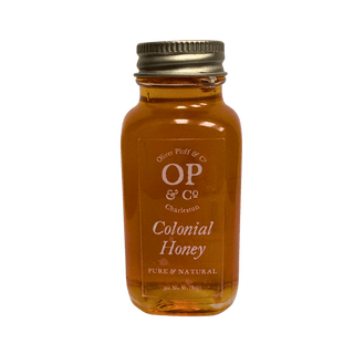 Bottle of Colonial Honey with 'OP & Co' label on a green background