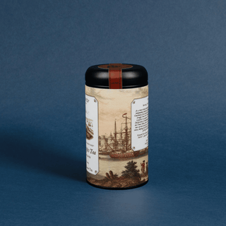Tea canister with vintage ship design on a blue background