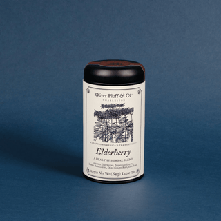 Tea canister labeled 'Elderberry' by Oliver Pluff & Co on a blue background