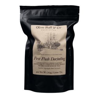 black resealable bag with kraft paper label that reads 'oliver pluff & co' first flush darjeeling