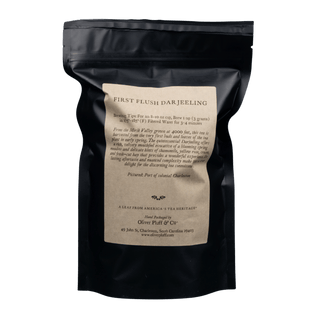 black resealable bag with kraft paper label that reads 'oliver pluff & co' first flush darjeeling