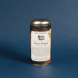 Coffee canister labeled 'Green Dragon' by Oliver Pluff & Co on a blue background